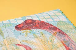 Puzzle z grą obserwacyjną Odkryj Dinozaury